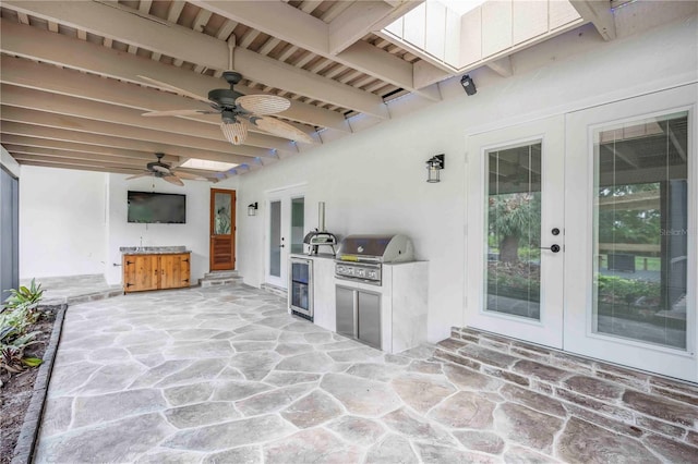 4916 Hidden Oaks Trl, Sarasota, FL 34232 - view of patio featuring french doors, area for grilling, ceiling fan, and beverage cooler