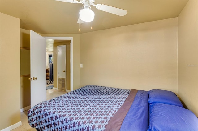bedroom featuring baseboards and ceiling fan
