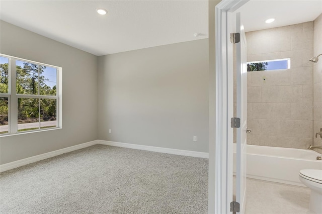 full bath with baseboards, a wealth of natural light, and bathing tub / shower combination