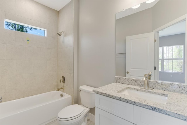 bathroom featuring baseboards, shower / bathtub combination, vanity, and toilet