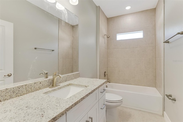 full bathroom with tile patterned flooring, toilet, vanity, and shower / tub combination