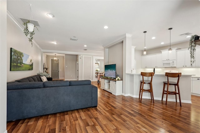 5023 Brickell Park Cv, Bradenton, FL 34211 - living area featuring crown molding, wood finished floors, recessed lighting, and baseboards