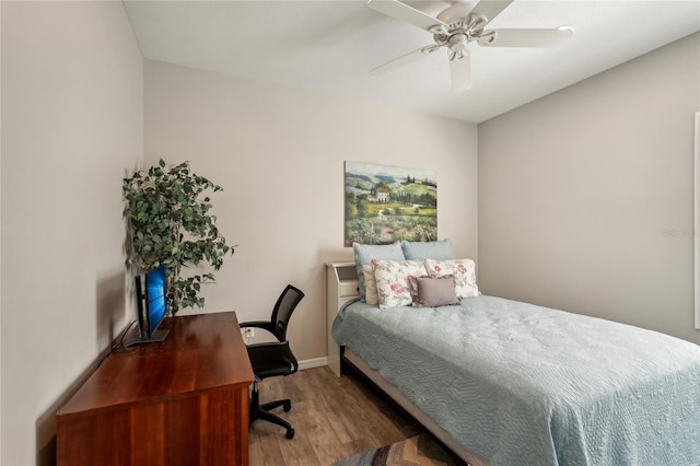 5023 Brickell Park Cv, Bradenton, FL 34211 - bedroom with wood finished floors, an office area, and ceiling fan