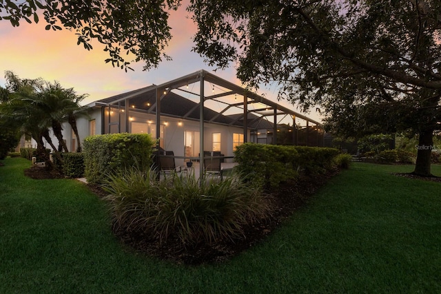 5023 Brickell Park Cv, Bradenton, FL 34211 - back of house with a lawn and a lanai