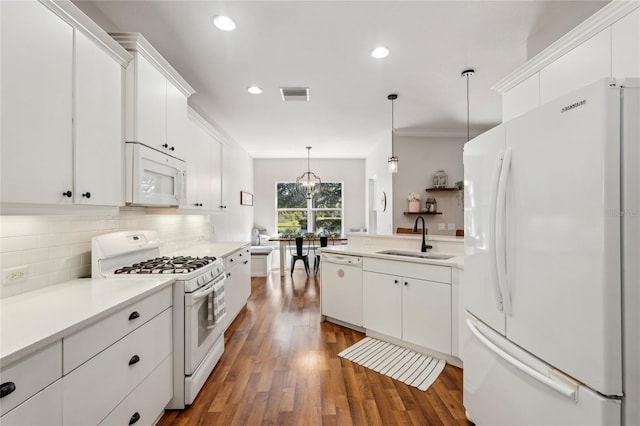 5023 Brickell Park Cv, Bradenton, FL 34211 - kitchen featuring white appliances, a sink, decorative backsplash, white cabinetry, and dark wood finished floors