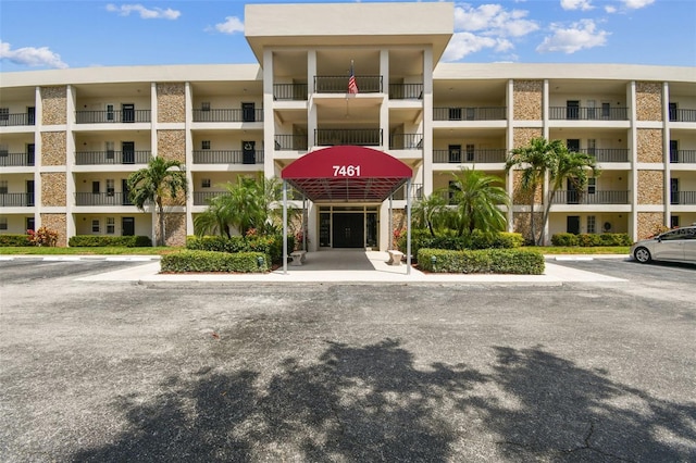 7461 W Country Club Dr N Unit 408, Sarasota, FL 34243 - view of building exterior featuring uncovered parking