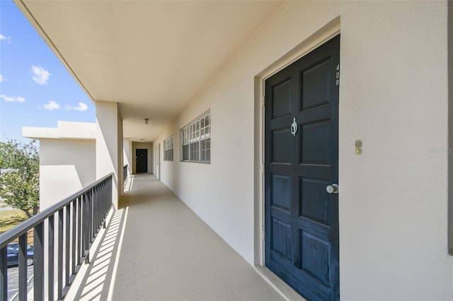 7461 W Country Club Dr N Unit 408, Sarasota, FL 34243 - entrance to property with stucco siding and a balcony