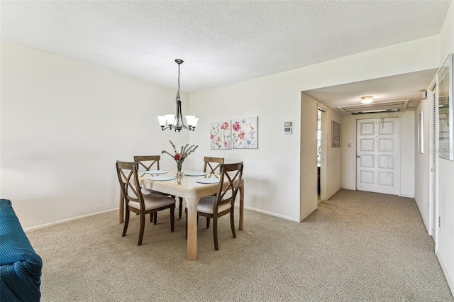 7461 W Country Club Dr N Unit 408, Sarasota, FL 34243 - dining area featuring a chandelier, a textured ceiling, carpet flooring, and baseboards