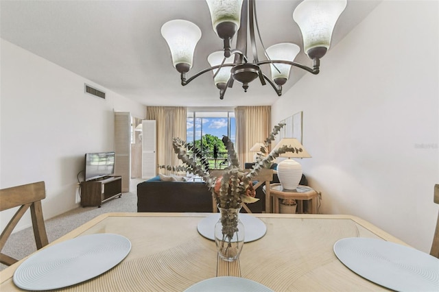 7461 W Country Club Dr N Unit 408, Sarasota, FL 34243 - carpeted dining room featuring a notable chandelier and visible vents