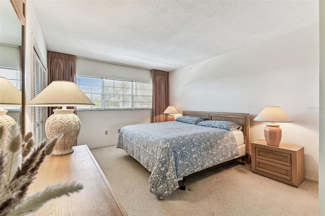 7461 W Country Club Dr N Unit 408, Sarasota, FL 34243 - bedroom featuring carpet floors and a textured ceiling
