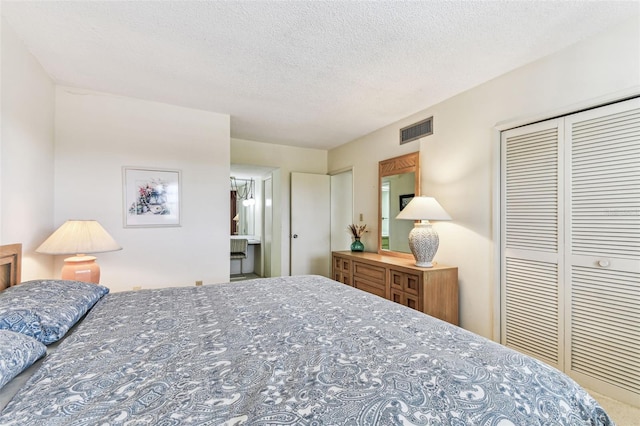 7461 W Country Club Dr N Unit 408, Sarasota, FL 34243 - bedroom with visible vents, a closet, carpet floors, and a textured ceiling