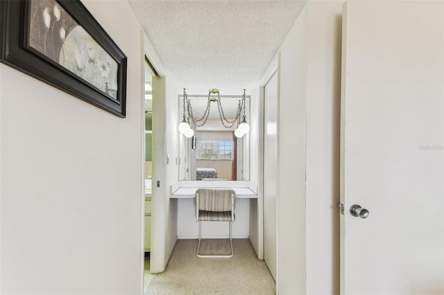 7461 W Country Club Dr N Unit 408, Sarasota, FL 34243 - hall with a textured ceiling, baseboards, and carpet floors