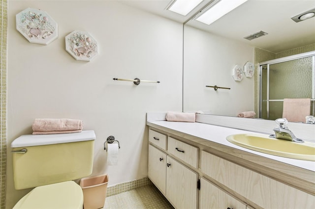 7461 W Country Club Dr N Unit 408, Sarasota, FL 34243 - full bathroom featuring toilet, a stall shower, vanity, and visible vents