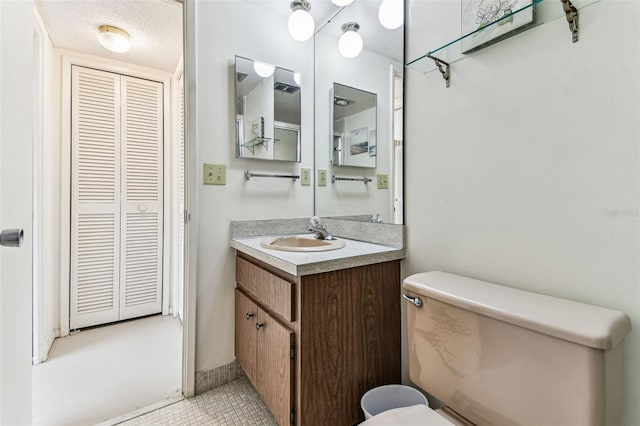 7461 W Country Club Dr N Unit 408, Sarasota, FL 34243 - bathroom featuring a closet, toilet, vanity, and tile patterned flooring