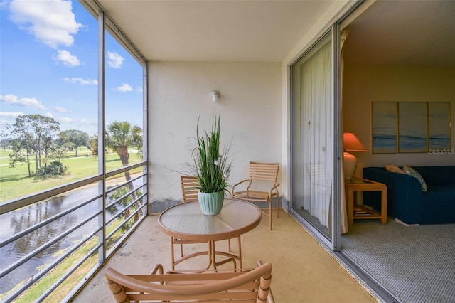 7461 W Country Club Dr N Unit 408, Sarasota, FL 34243 - sunroom / solarium featuring carpet