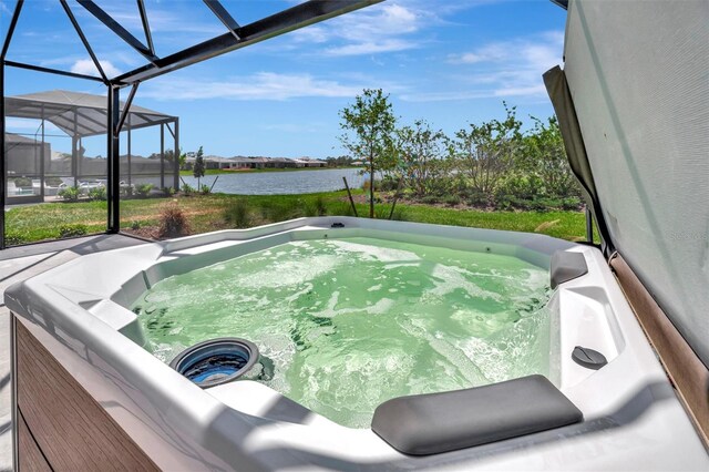 27061 Paradise Shores Dr, Englewood, FL 34223 - sunroom featuring a hot tub and a water view