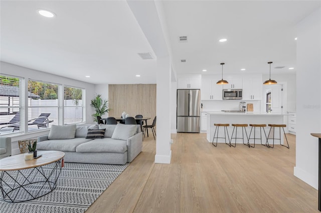 1921 Fern Ave, Sarasota, FL 34235 - living area featuring light wood-style flooring, baseboards, visible vents, and recessed lighting