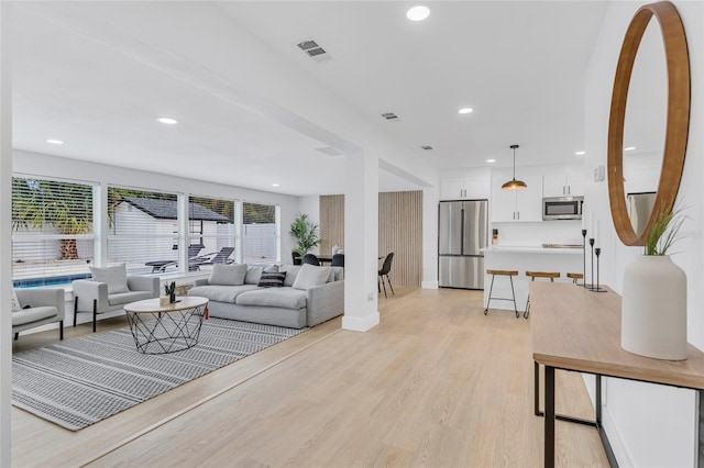 1921 Fern Ave, Sarasota, FL 34235 - living area featuring visible vents, light wood-style flooring, baseboards, and recessed lighting