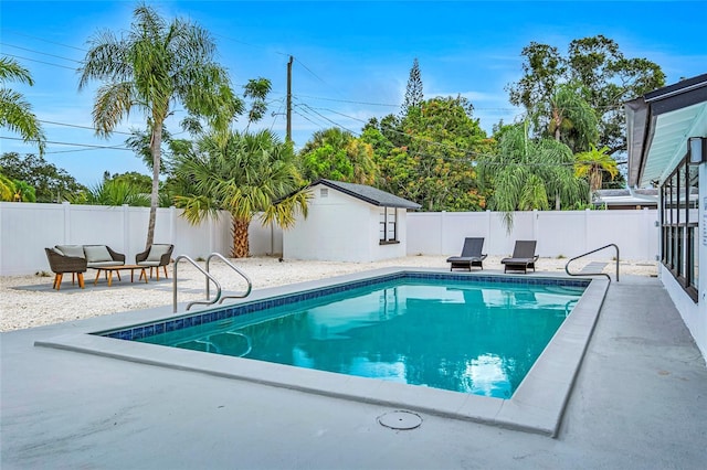 1921 Fern Ave, Sarasota, FL 34235 - view of swimming pool featuring a fenced backyard, a patio, a fenced in pool, and an outbuilding