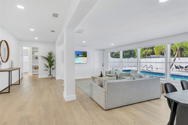 1921 Fern Ave, Sarasota, FL 34235 - living area featuring light wood finished floors and recessed lighting