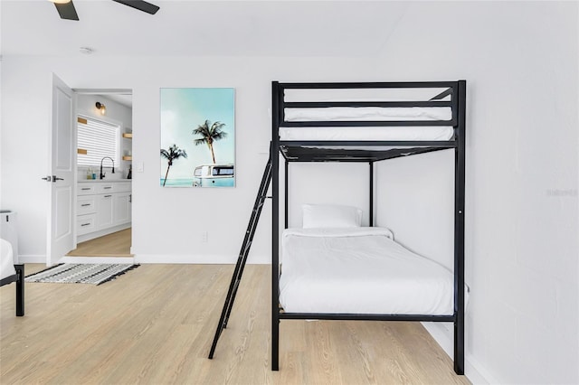 1921 Fern Ave, Sarasota, FL 34235 - unfurnished bedroom with light wood-type flooring, ensuite bath, and a ceiling fan