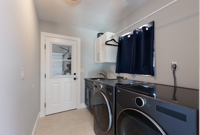 508 70th St, Holmes Beach, FL 34217 - laundry area featuring baseboards, light tile patterned floors, independent washer and dryer, cabinet space, and a sink