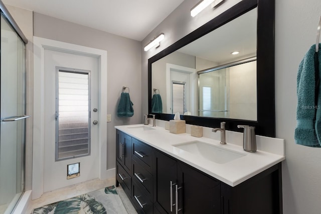 508 70th St, Holmes Beach, FL 34217 - full bath featuring a shower stall, double vanity, and a sink