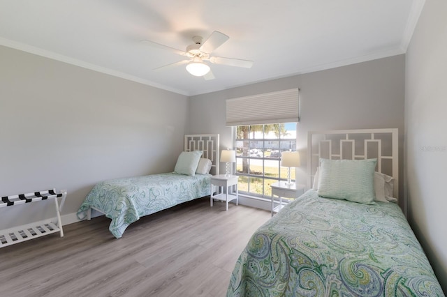 508 70th St, Holmes Beach, FL 34217 - bedroom featuring crown molding, wood finished floors, and a ceiling fan
