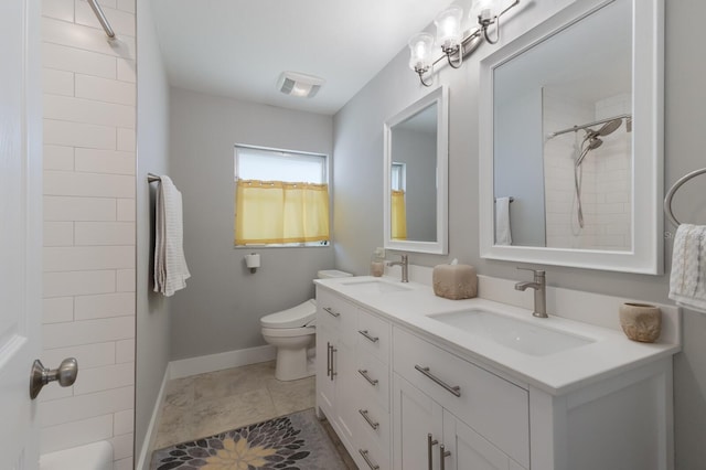 508 70th St, Holmes Beach, FL 34217 - full bath with double vanity, baseboards, a sink, and toilet