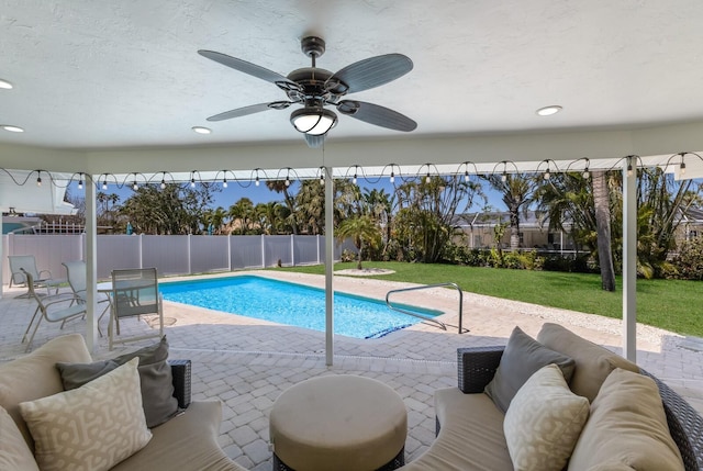 508 70th St, Holmes Beach, FL 34217 - view of pool with a yard, ceiling fan, a fenced backyard, an outdoor living space, and a patio