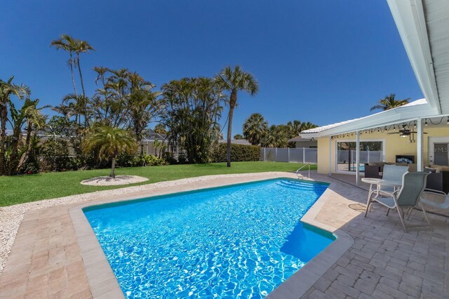 508 70th St, Holmes Beach, FL 34217 - view of swimming pool featuring a yard, ceiling fan, a fenced backyard, a patio, and a fenced in pool