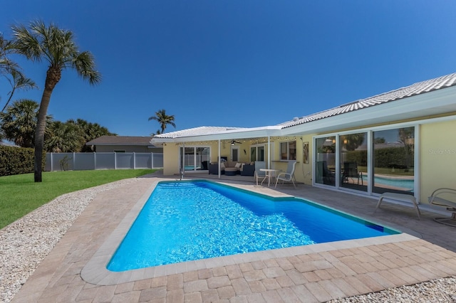508 70th St, Holmes Beach, FL 34217 - view of pool with an outdoor living space, ceiling fan, a yard, a patio, and fence