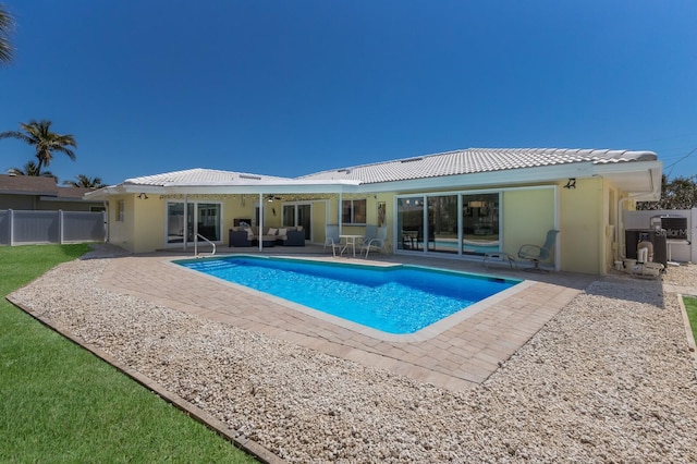 508 70th St, Holmes Beach, FL 34217 - view of swimming pool with ceiling fan, outdoor lounge area, fence, a patio, and a fenced in pool