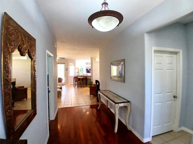 6631 63rd Ter E, Bradenton, FL 34203 - hall featuring tile patterned floors and baseboards