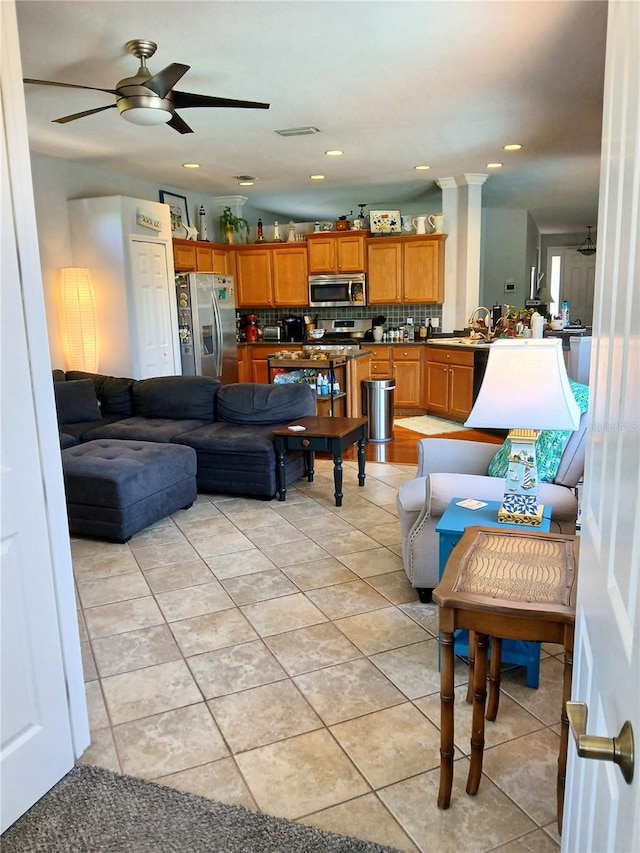 6631 63rd Ter E, Bradenton, FL 34203 - living area with a ceiling fan, light tile patterned floors, and recessed lighting