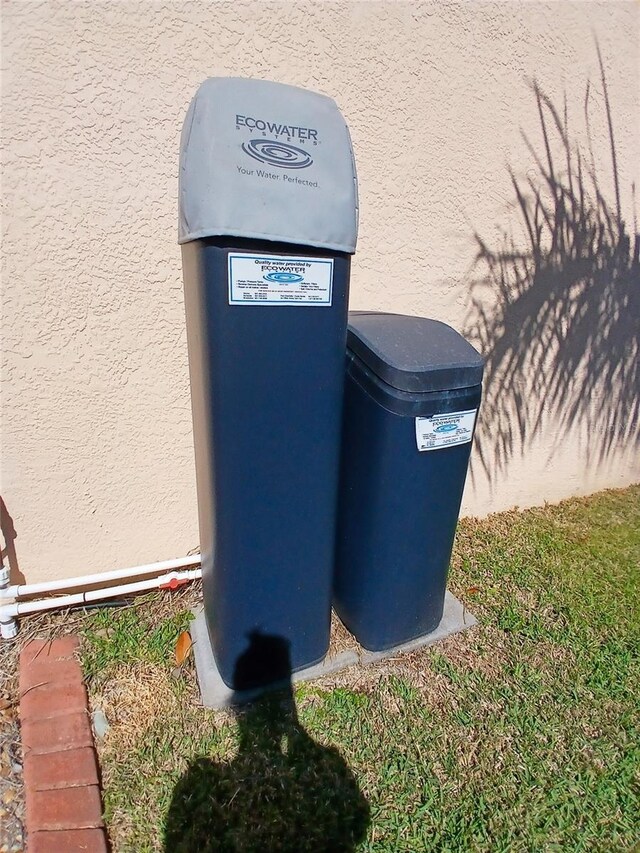 6631 63rd Ter E, Bradenton, FL 34203 - exterior view of a water softener system and stucco siding