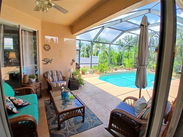6631 63rd Ter E, Bradenton, FL 34203 - swimming pool with a patio, a ceiling fan, an outdoor living space, and a lanai