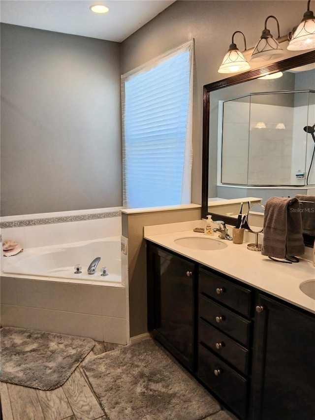6631 63rd Ter E, Bradenton, FL 34203 - bathroom with a bath and double vanity