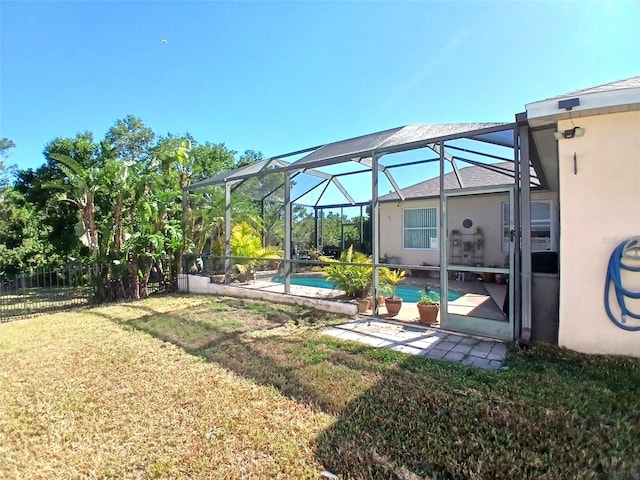 6631 63rd Ter E, Bradenton, FL 34203 - view of yard featuring an outdoor pool, glass enclosure, and a patio