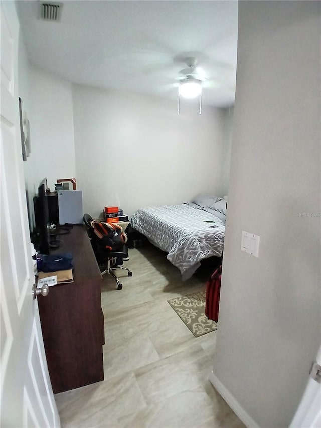 6631 63rd Ter E, Bradenton, FL 34203 - bedroom featuring an office area and a ceiling fan