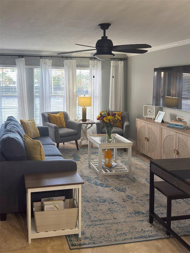 living room with ceiling fan and a textured ceiling