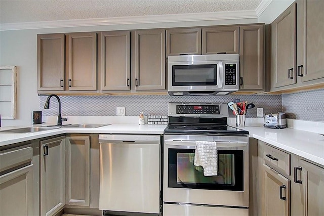 kitchen featuring light countertops, a sink, and stainless steel appliances
