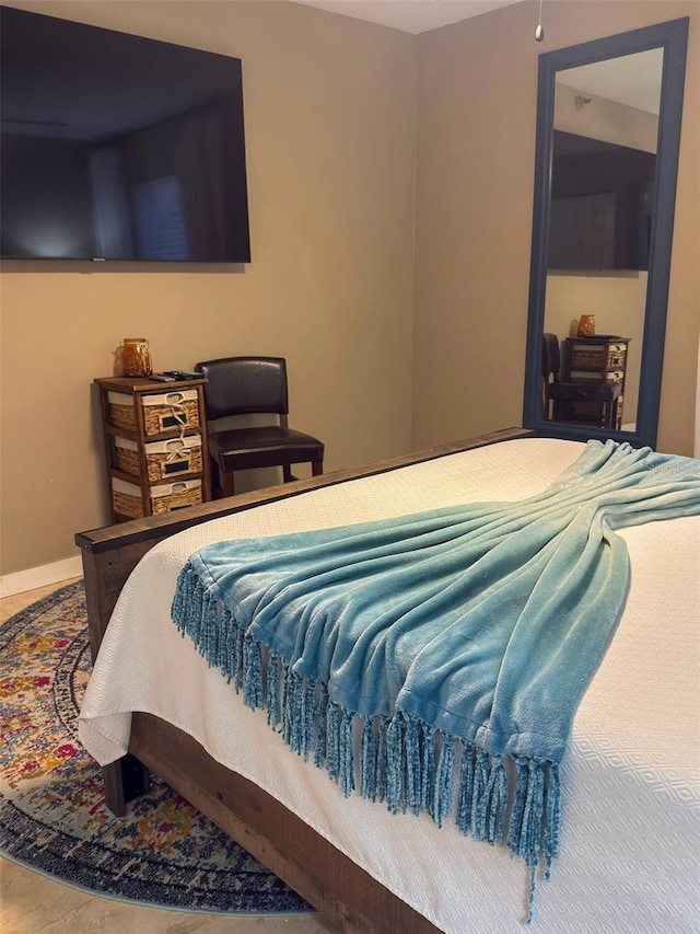 bedroom featuring baseboards