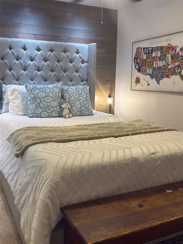 bedroom with wooden walls
