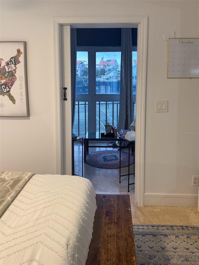 carpeted bedroom with baseboards