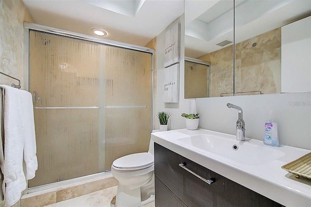full bath with visible vents, toilet, a stall shower, and vanity