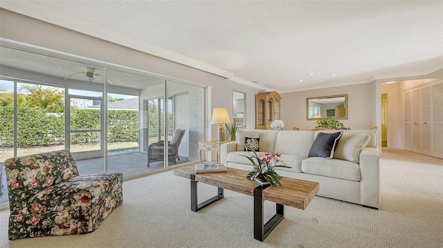 living room featuring crown molding, recessed lighting, and carpet floors