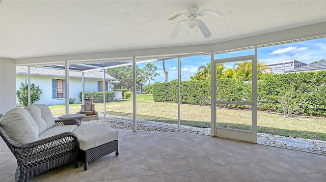 sunroom with ceiling fan and a healthy amount of sunlight