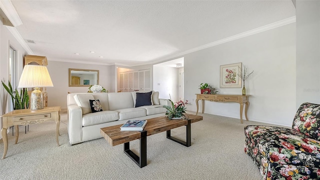 carpeted living room featuring visible vents, crown molding, and baseboards