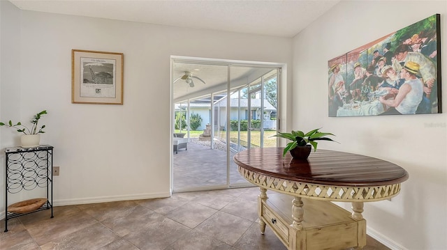 doorway featuring baseboards